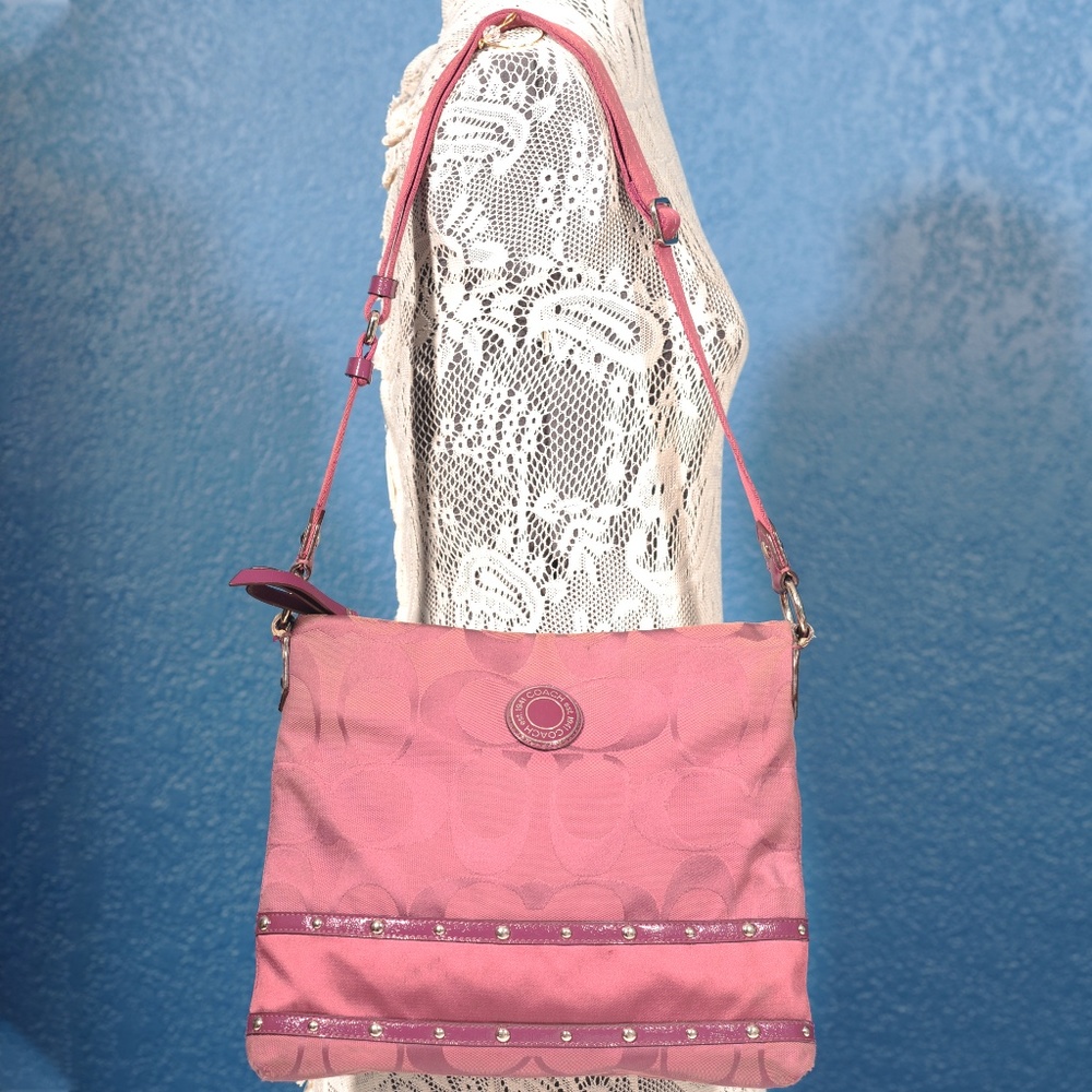 Purple Coach purse with adjustable strap